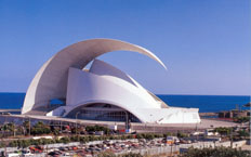 Aerial view of the Tenerife opera house and auditorium, with the sea in the background.