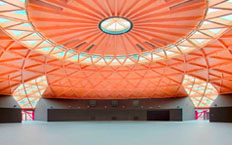 Interior view, showing the orange roof, of the new Les Arenes leisure centre.