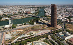 Aerial view of the Pelli Tower located on the Isla de la Cartuja with the city of Seville in the background